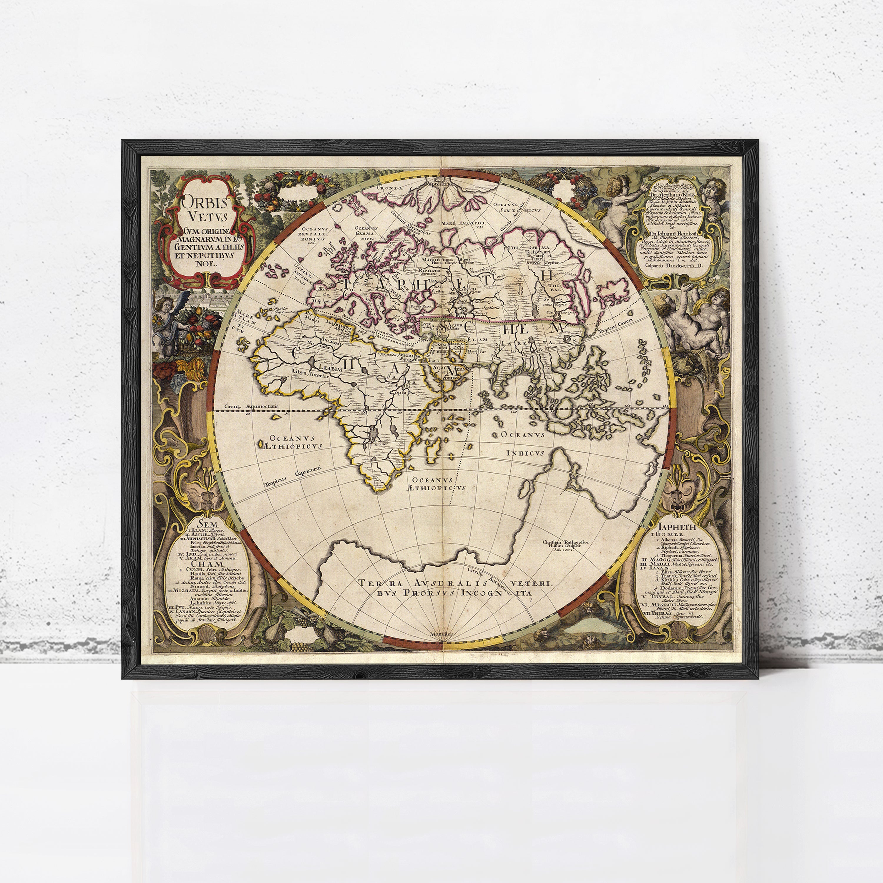 The image is a framed antique map of the world, featuring intricate details and decorative elements.