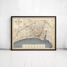 The image is a framed map of a city, likely a historical or geographical map, displayed on a wall.