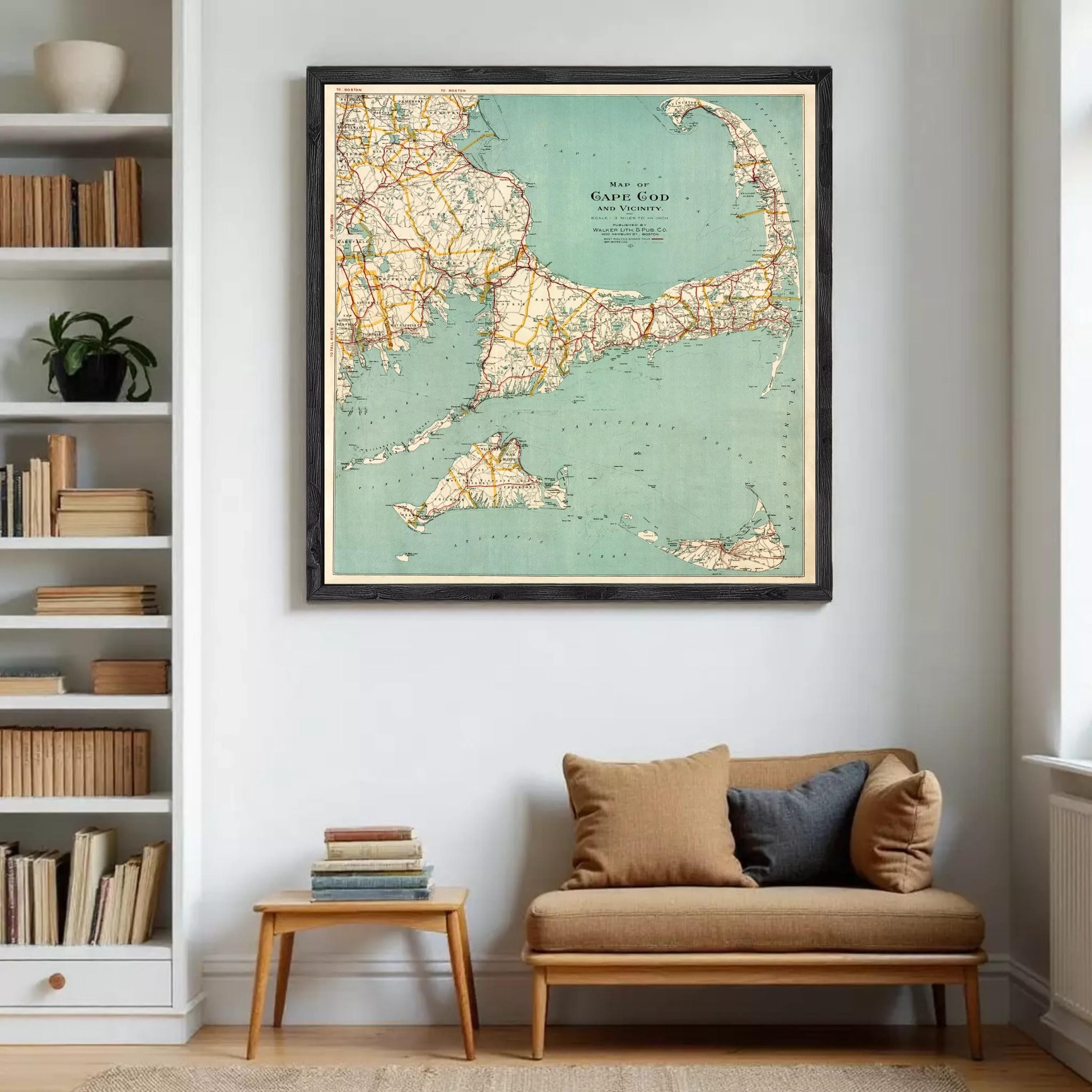 a large framed map of the Cape Cod region hanging on a wall in a living room.