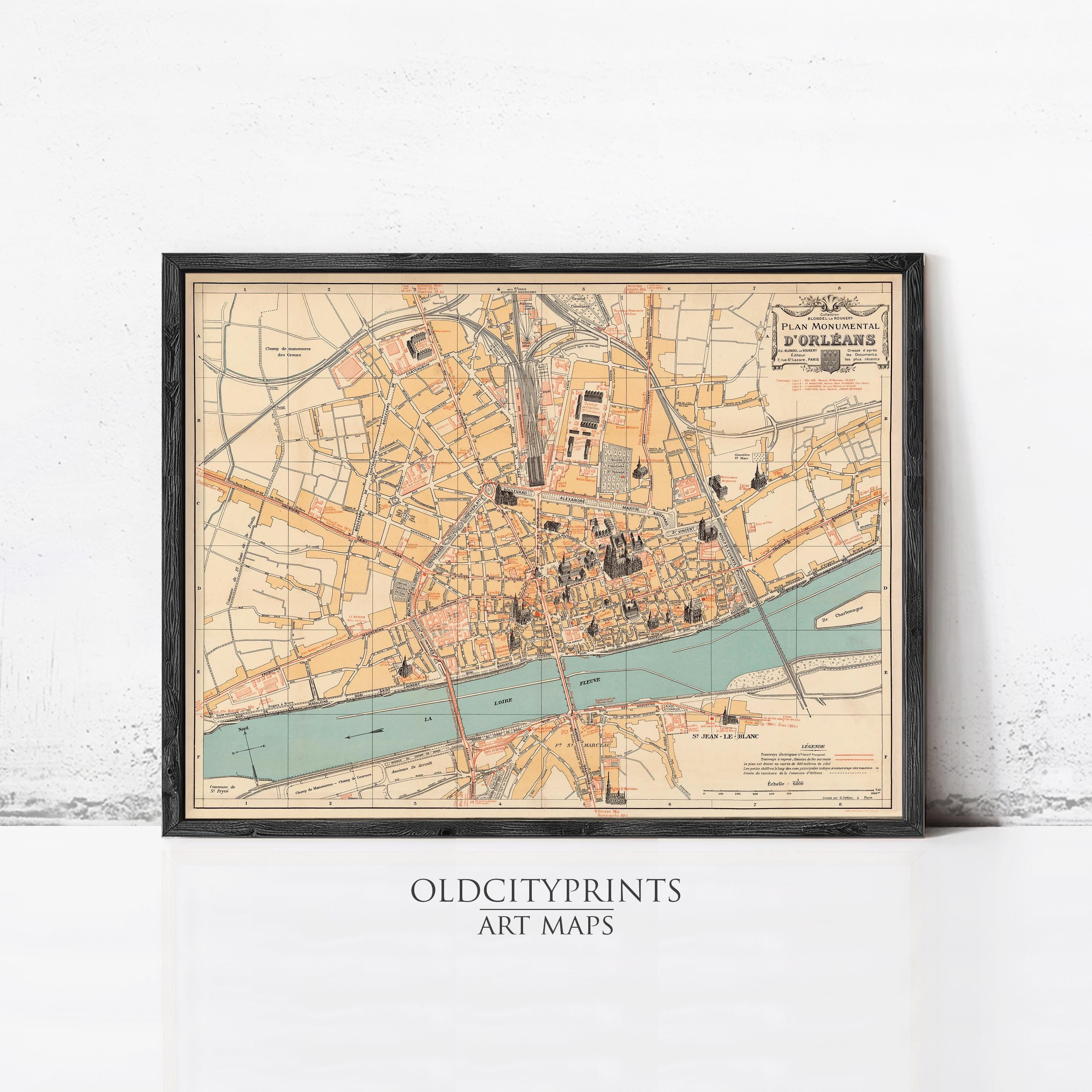 The image is a framed vintage map of a city, likely Paris, with various streets, landmarks, and a river depicted.