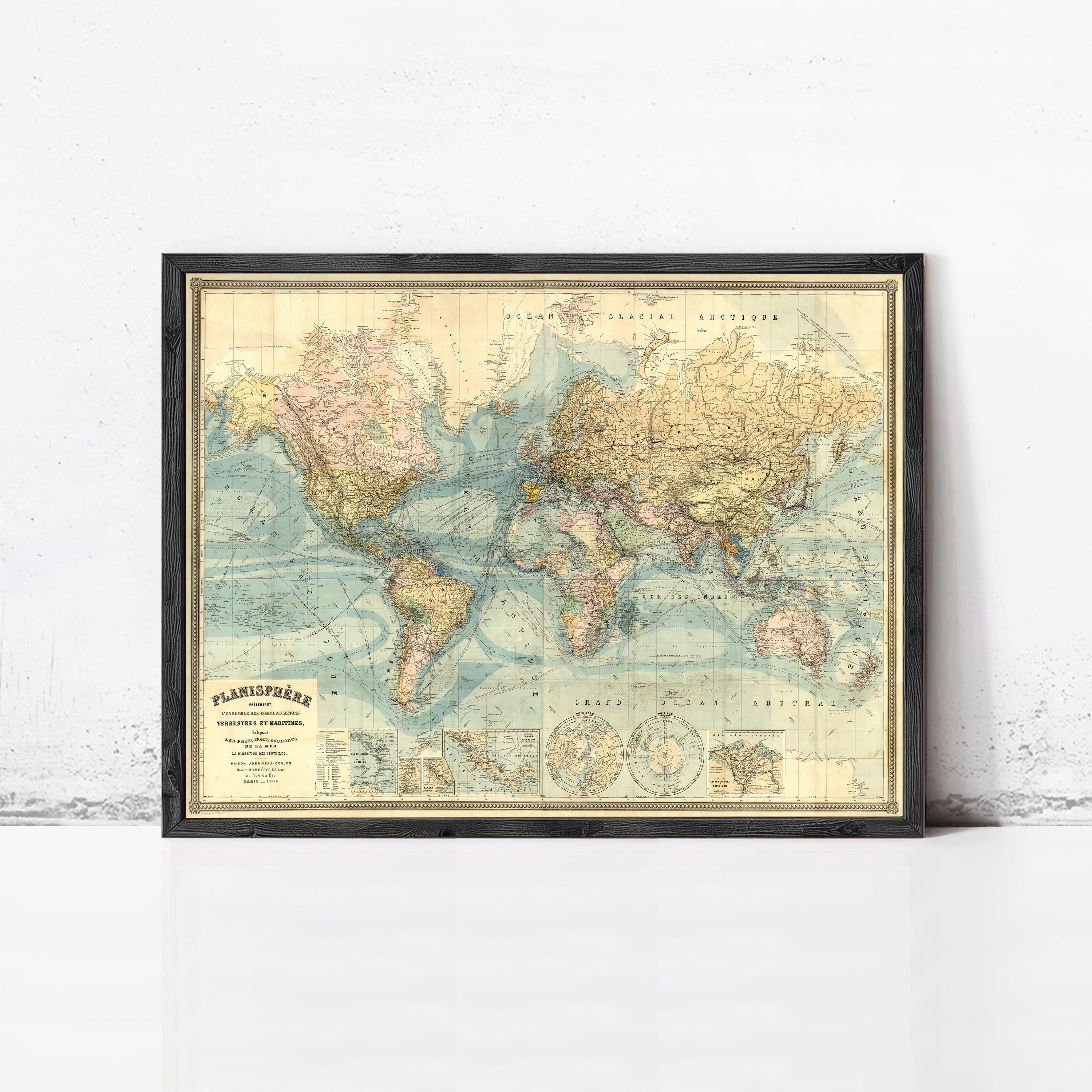 The image is a framed vintage map of the world, depicting the continents and oceans in a detailed and colorful manner.