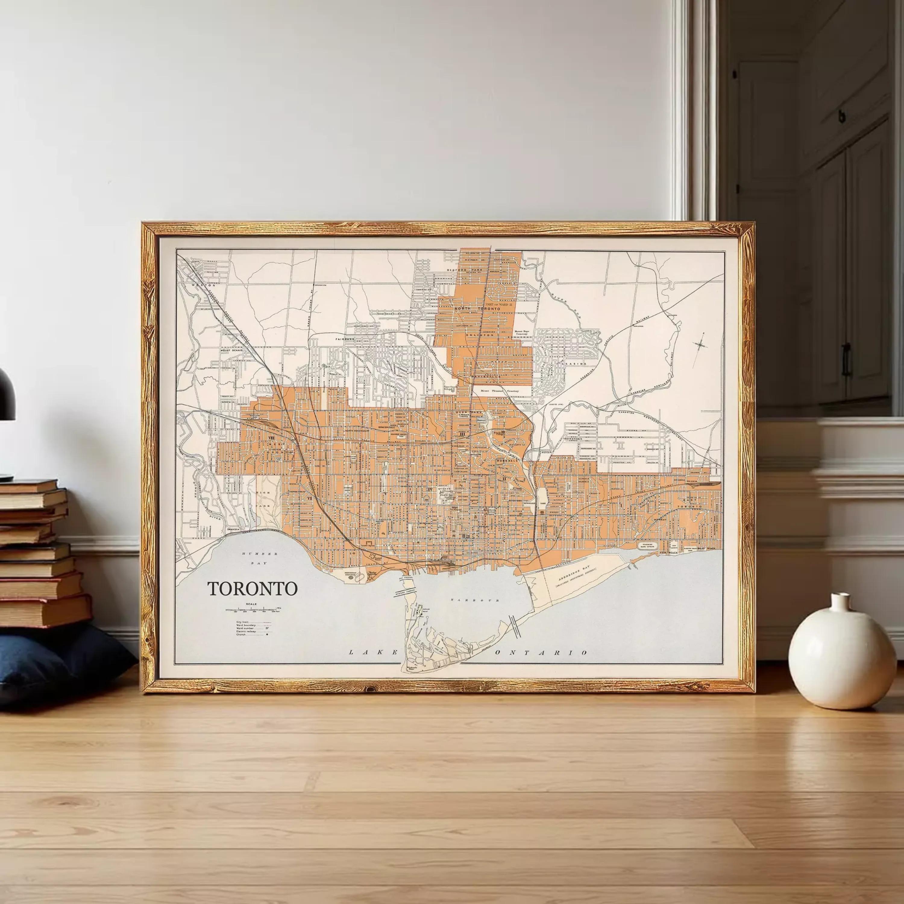 The image is a framed map of Toronto, Canada, showing the city's streets and surrounding areas.