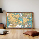 A framed map of Canada, depicting various regions and landmarks, is displayed on a white wall.