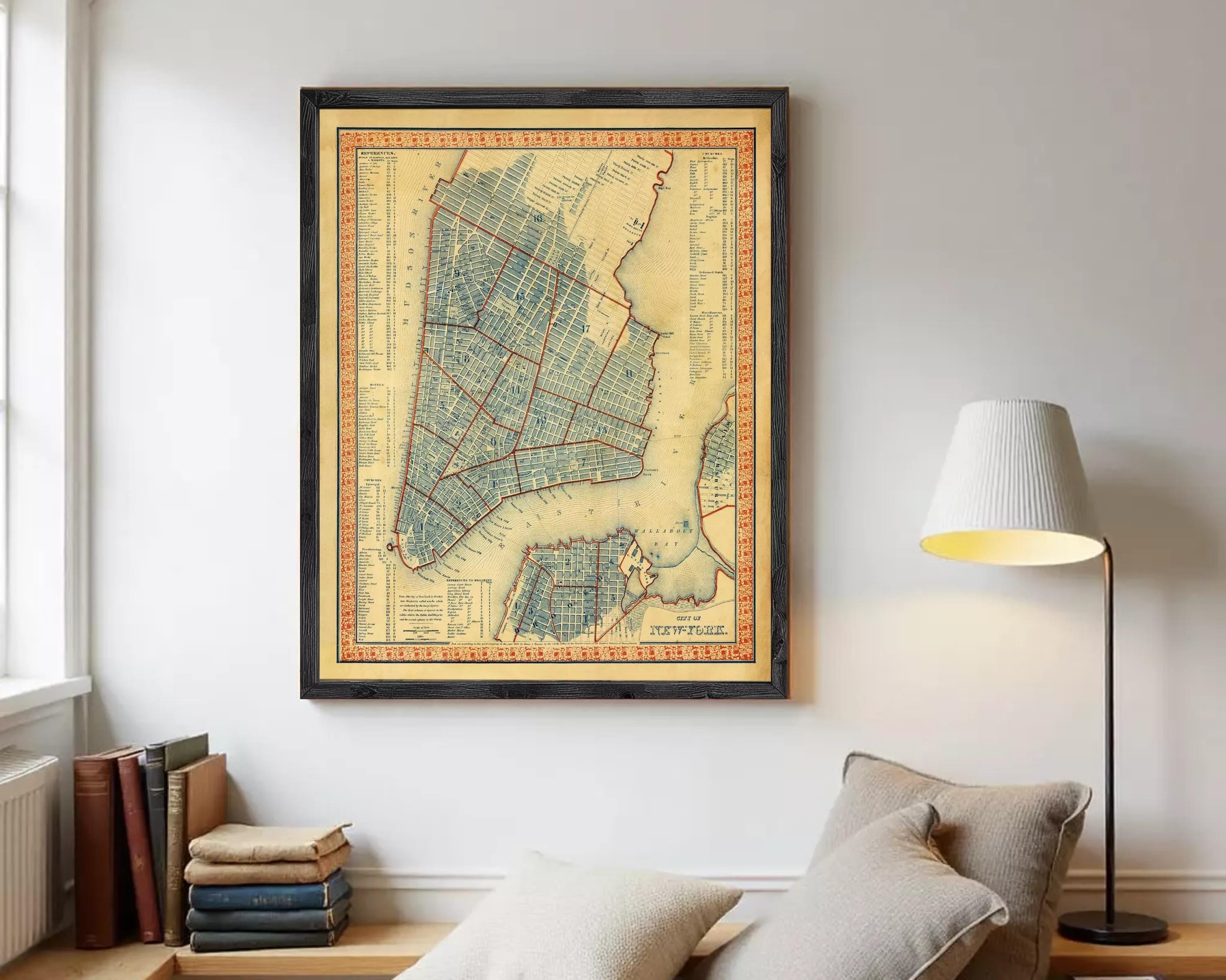 The image is a framed map of New York City, depicting the city's streets and neighborhoods in a detailed and colorful manner.