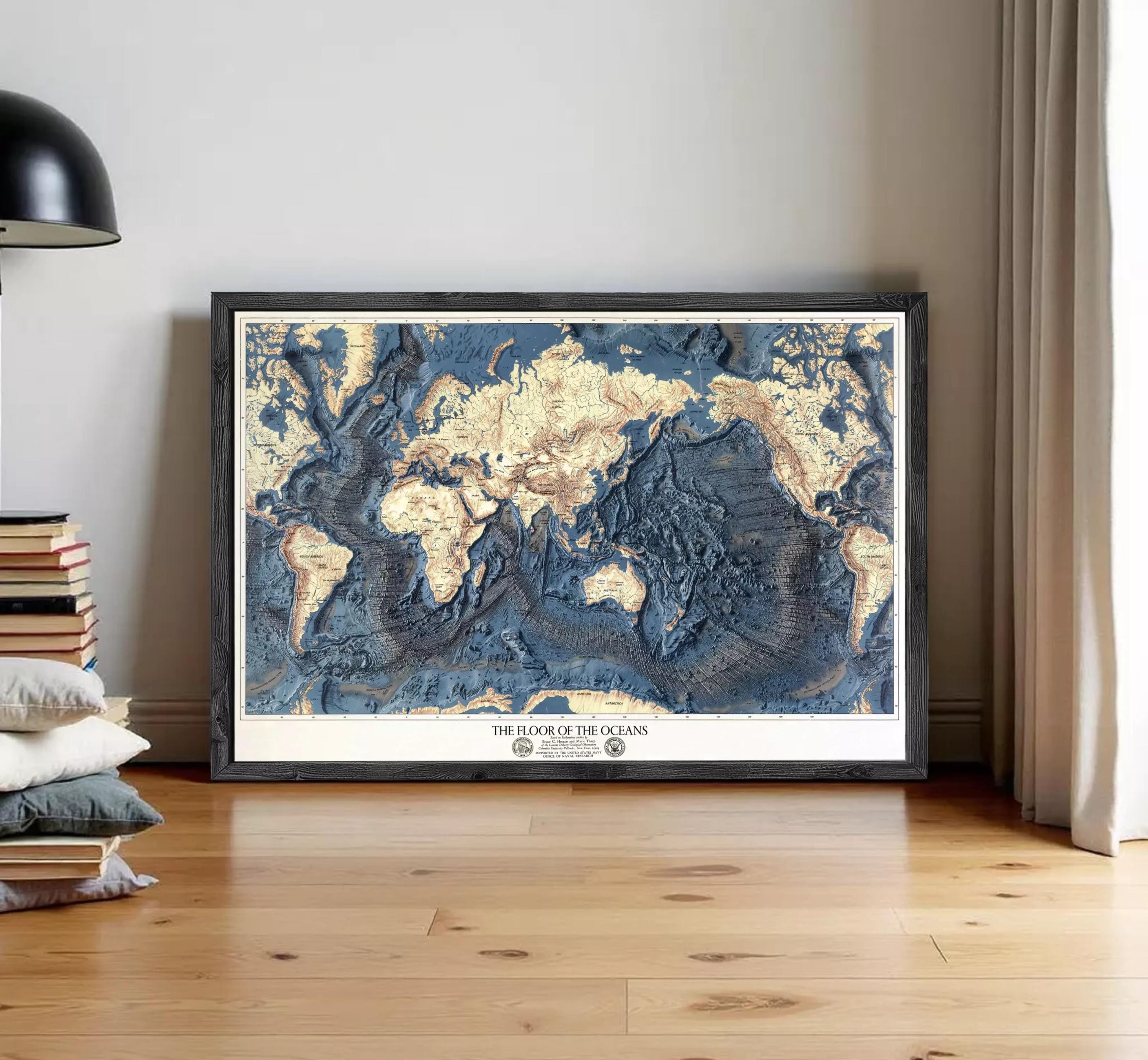 The image is a framed map of the world, specifically depicting the floor of the oceans.