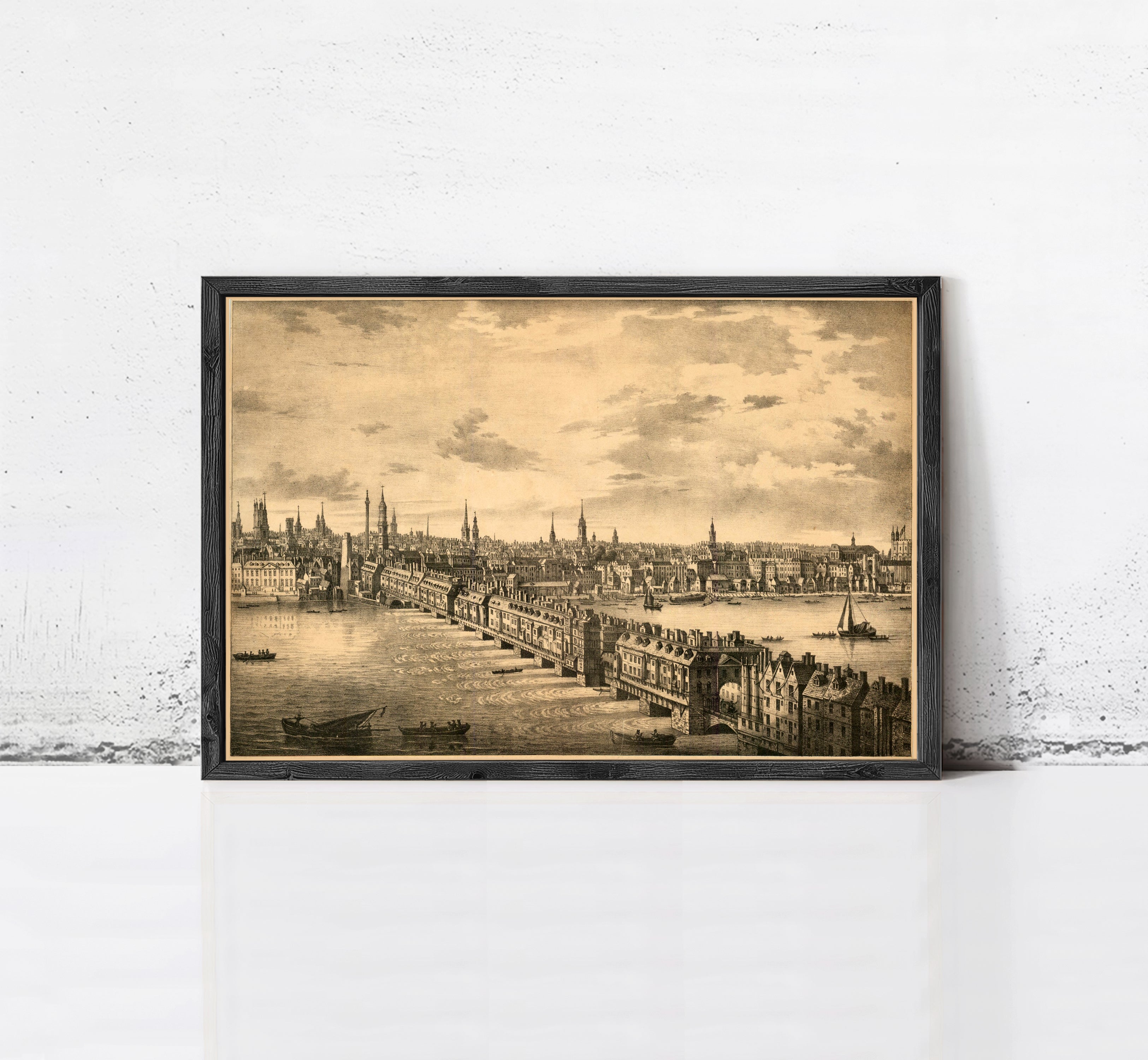 The image is a framed print depicting a cityscape with a river and boats, possibly from the 19th century.