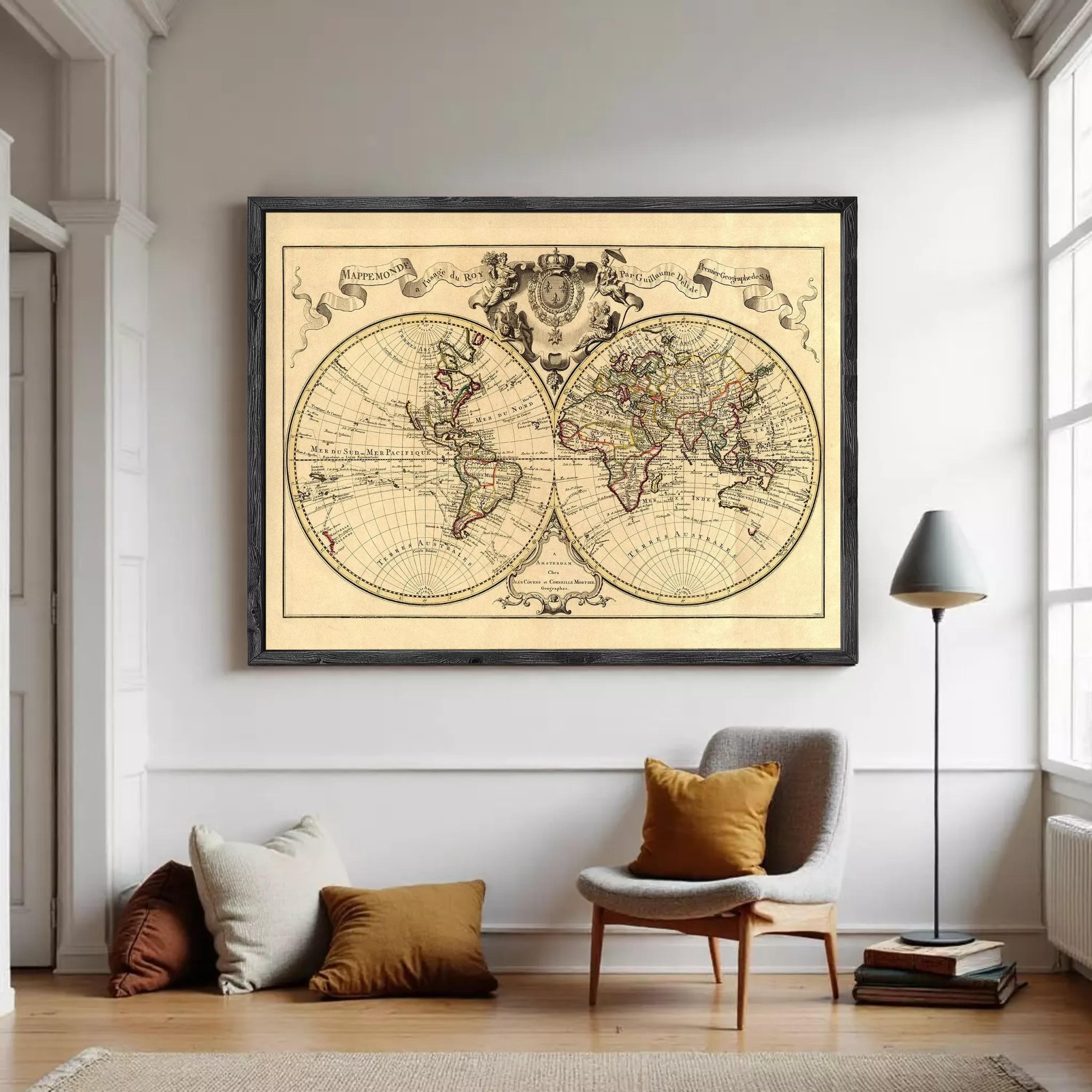 The image is a framed antique world map depicting the continents and oceans of the known world.