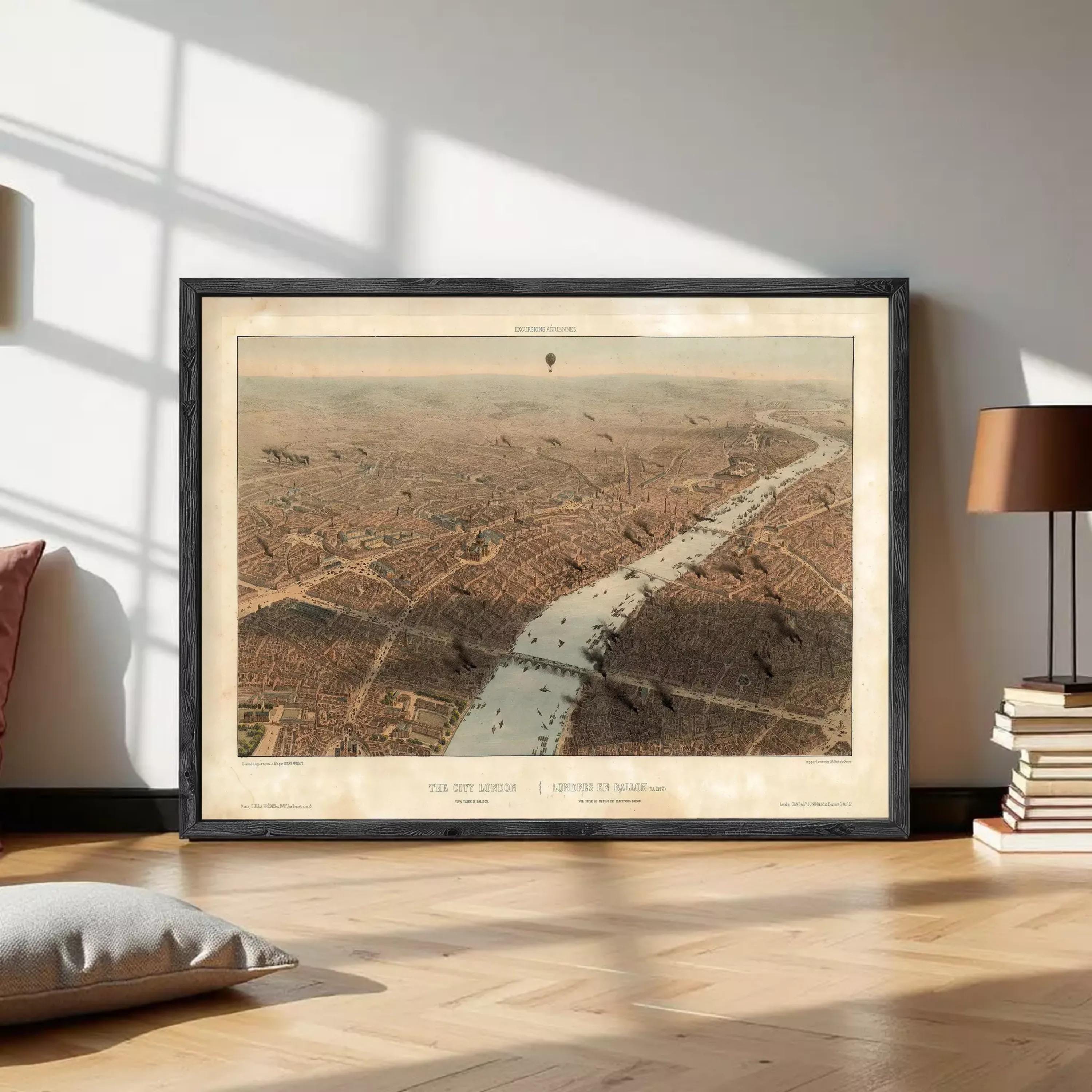The image is a framed aerial view of a city, depicting a river or canal running through the center of the city.