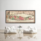 a large framed map of Long Island, New York, hanging on a wall above two white bean bag chairs in a minimalist living room setting.