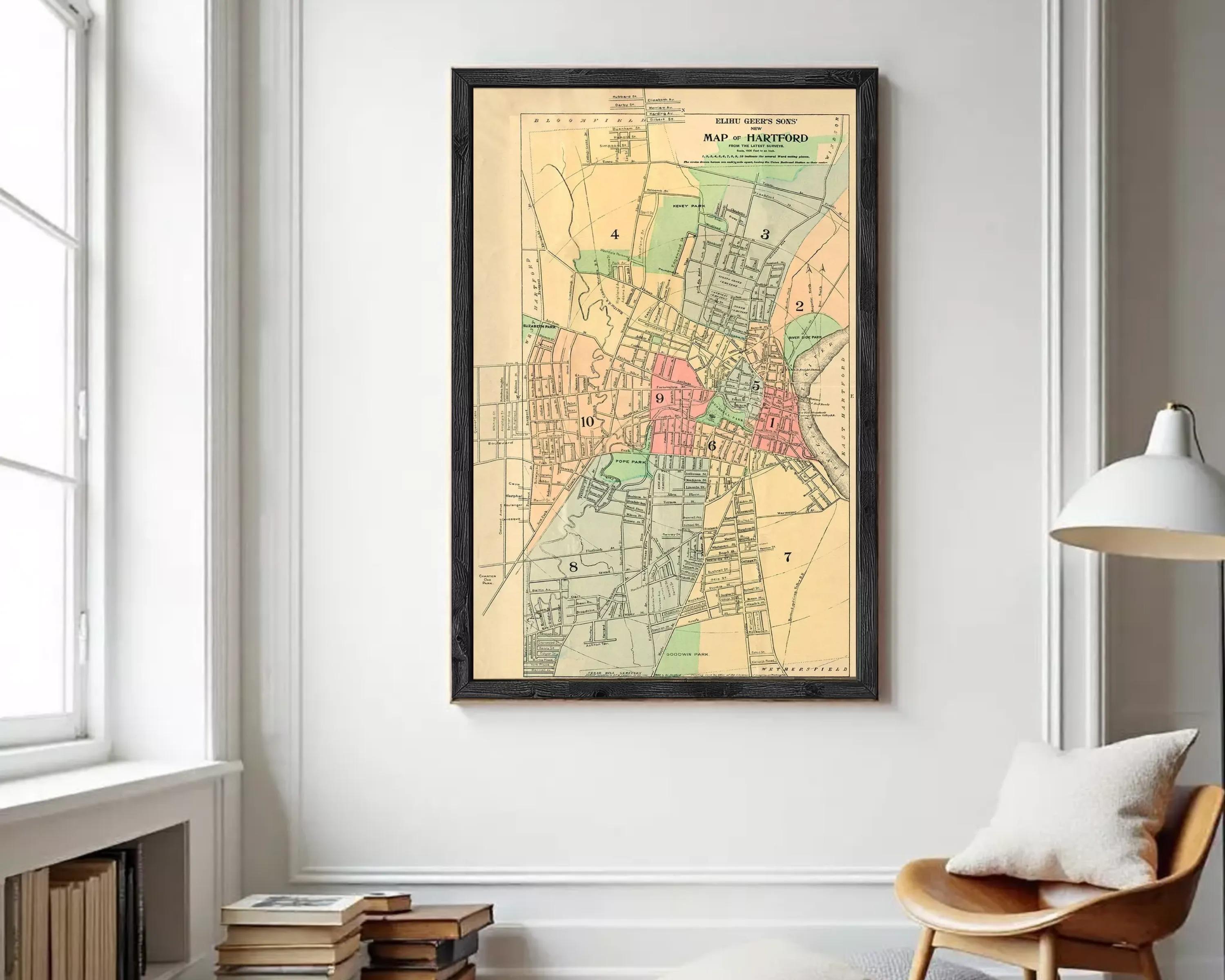 The image is a framed vintage map of the town of Hartford, Connecticut, showing the layout of the streets, neighborhoods, and other geographical features.