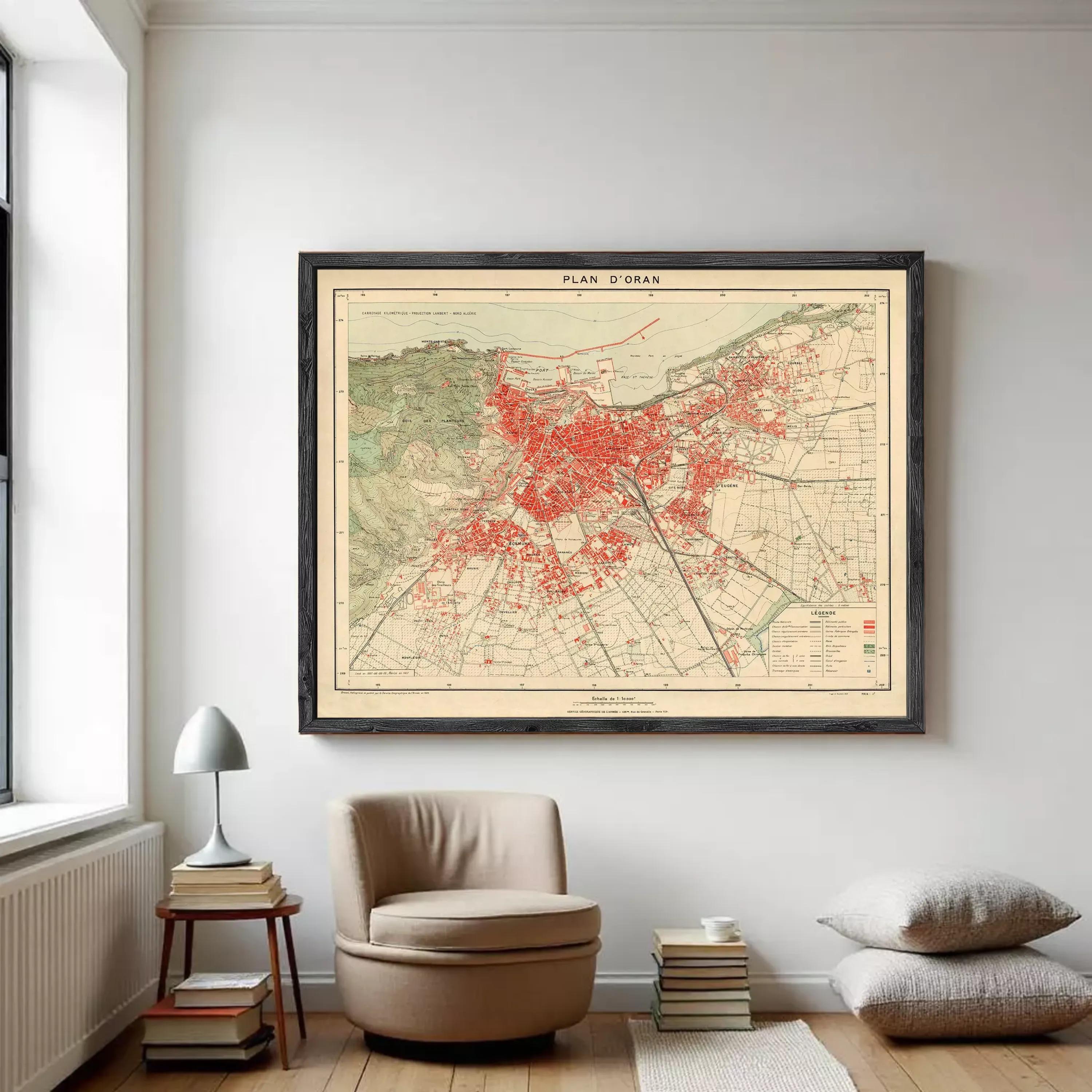 The image is a framed vintage map of a city, with a red color scheme and detailed street networks.
