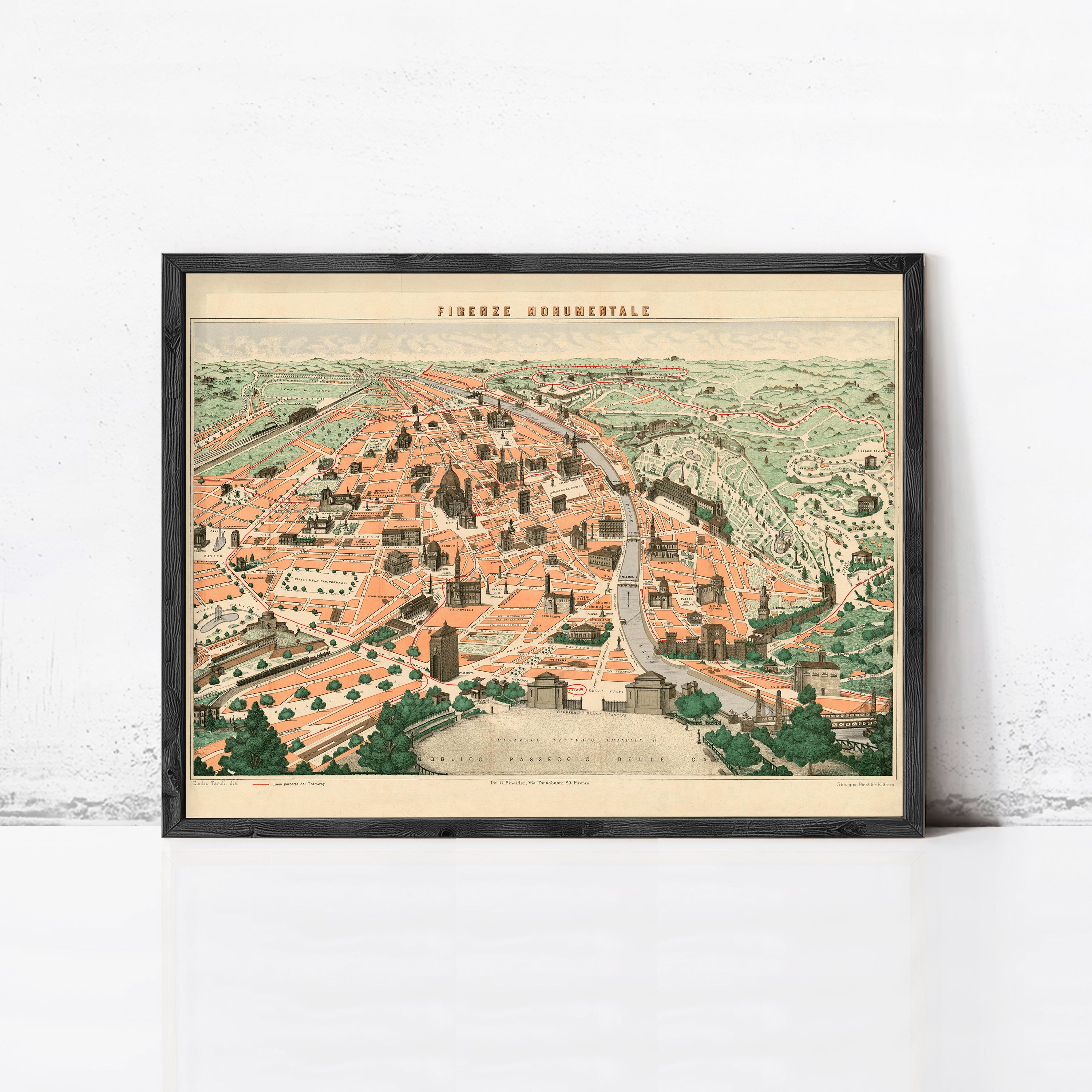 The image is a framed vintage map of a city, depicting a detailed and colorful cityscape with various buildings, roads, and natural elements.