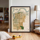 a framed map of Kansas City, Missouri, with a soccer ball and a stack of books visible in the foreground.