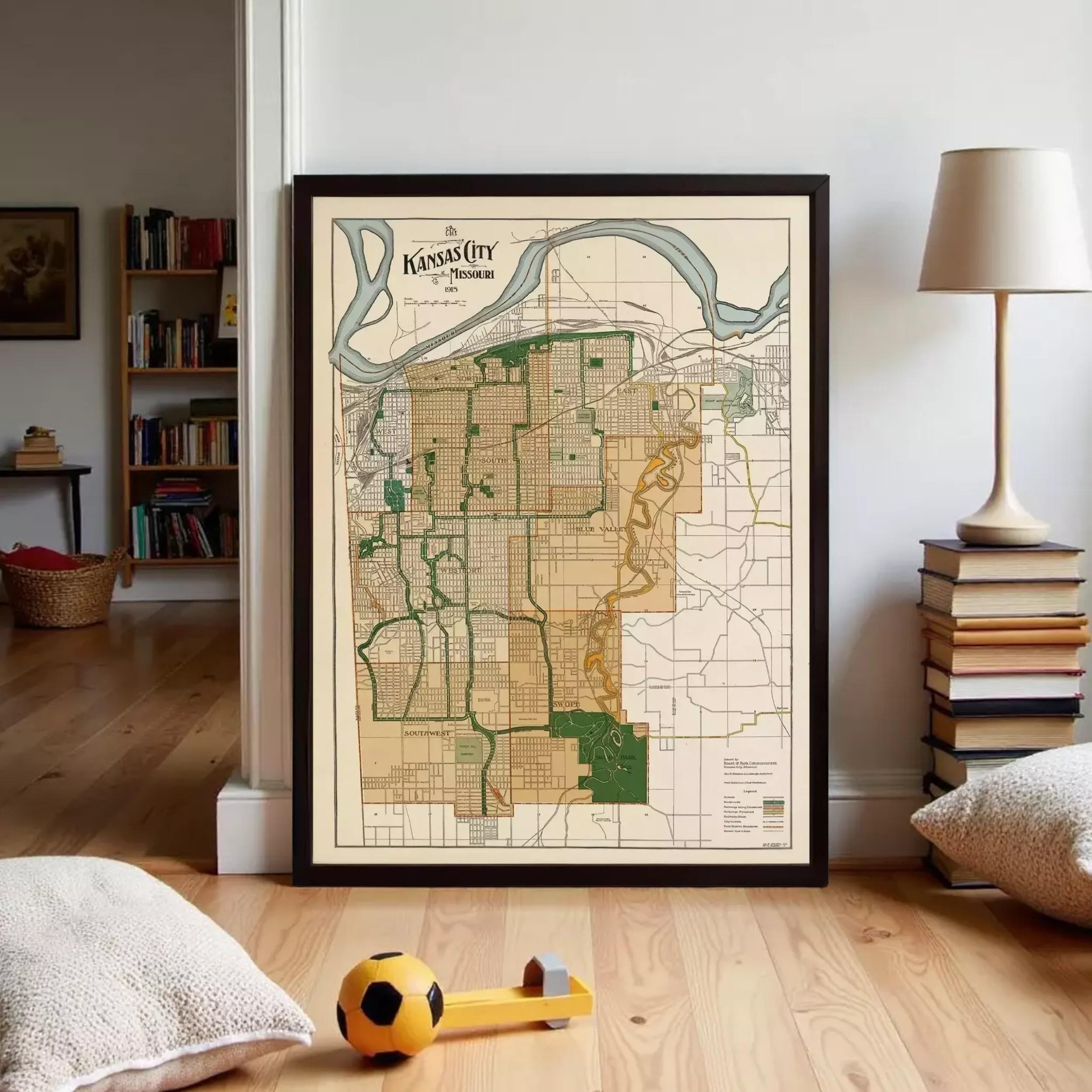 a framed map of Kansas City, Missouri, with a soccer ball and a stack of books visible in the foreground.