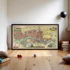 a large framed map of London, with various landmarks and streets visible. The map is displayed on a wooden floor, and there are a few balls and books scattered around the area.