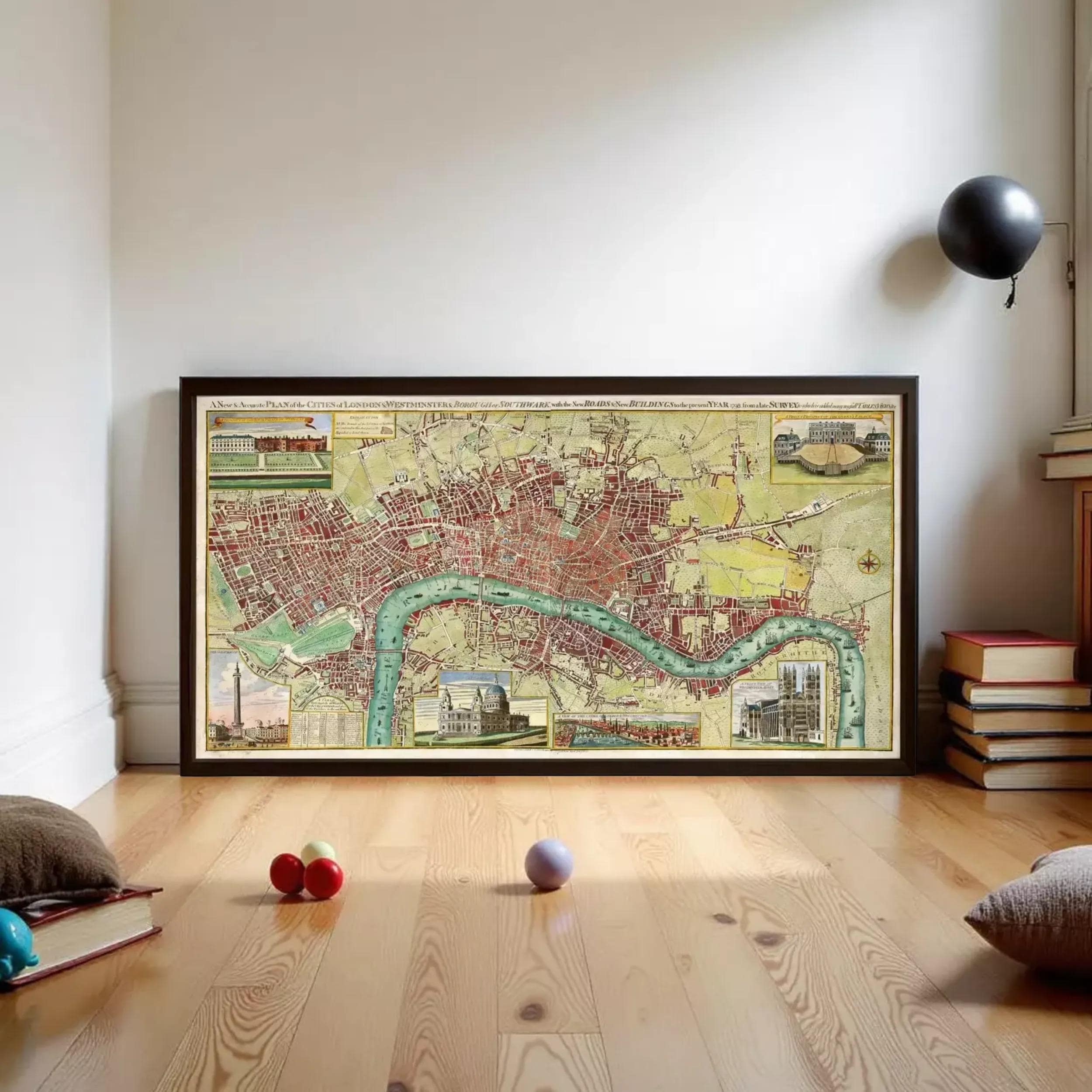 a large framed map of London, with various landmarks and streets visible. The map is displayed on a wooden floor, and there are a few balls and books scattered around the area.