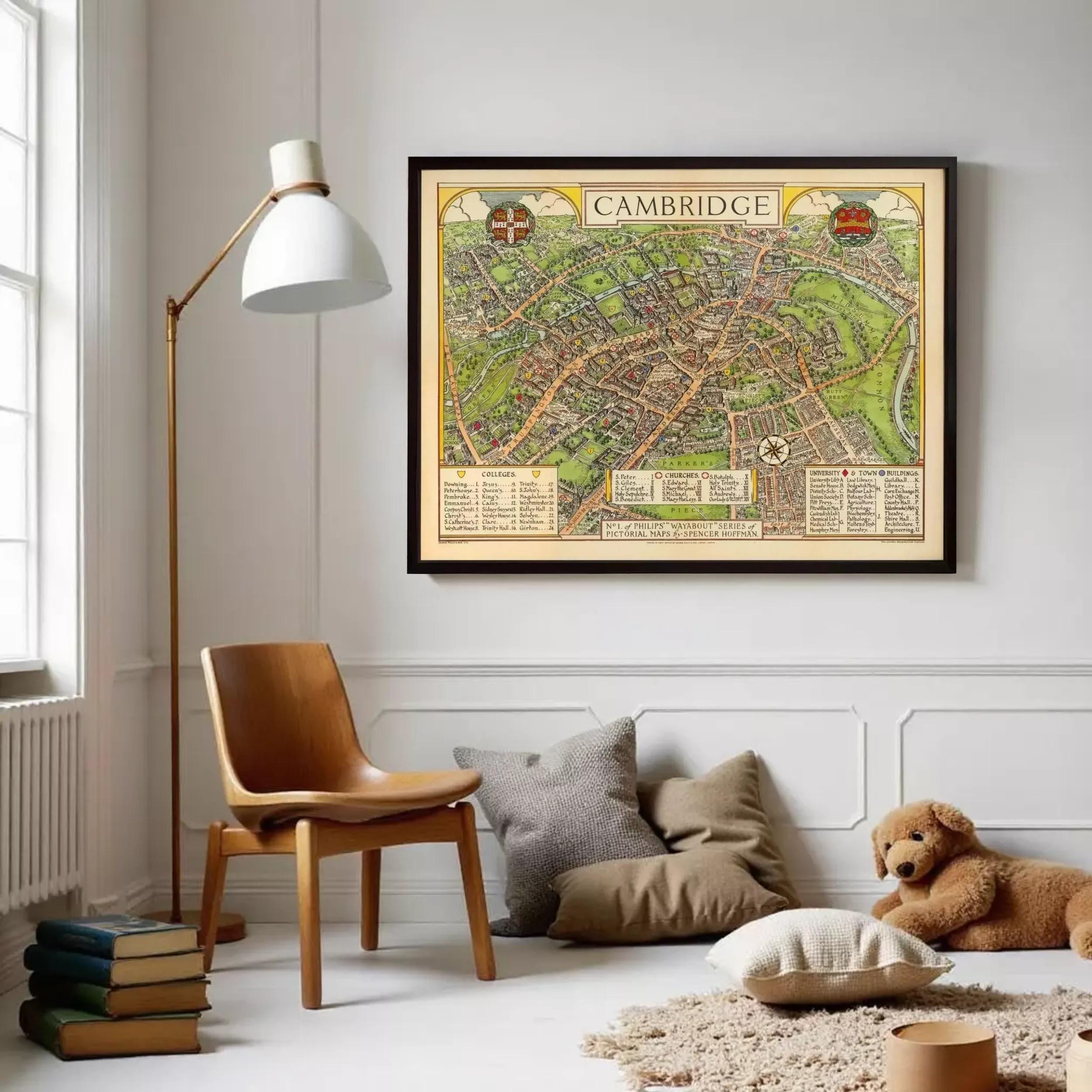 a cozy living room with a framed map of Cambridge hanging on the wall, a wooden chair, a stack of books, and a stuffed dog.
