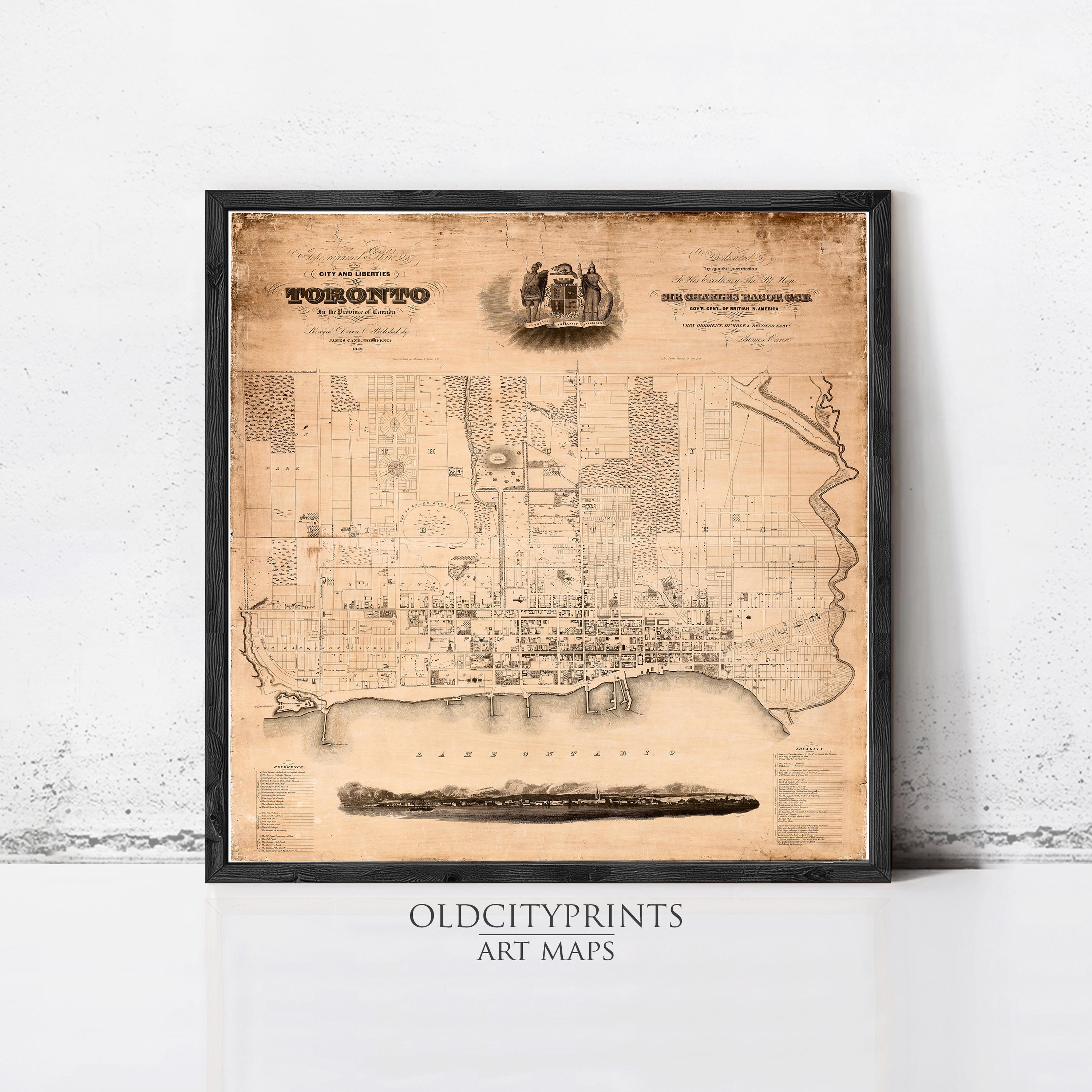 The image is a framed vintage map of Toronto, Canada, depicting the city's layout and surrounding areas.