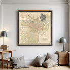 The image is a framed map of a city, depicting various streets, landmarks, and geographical features.