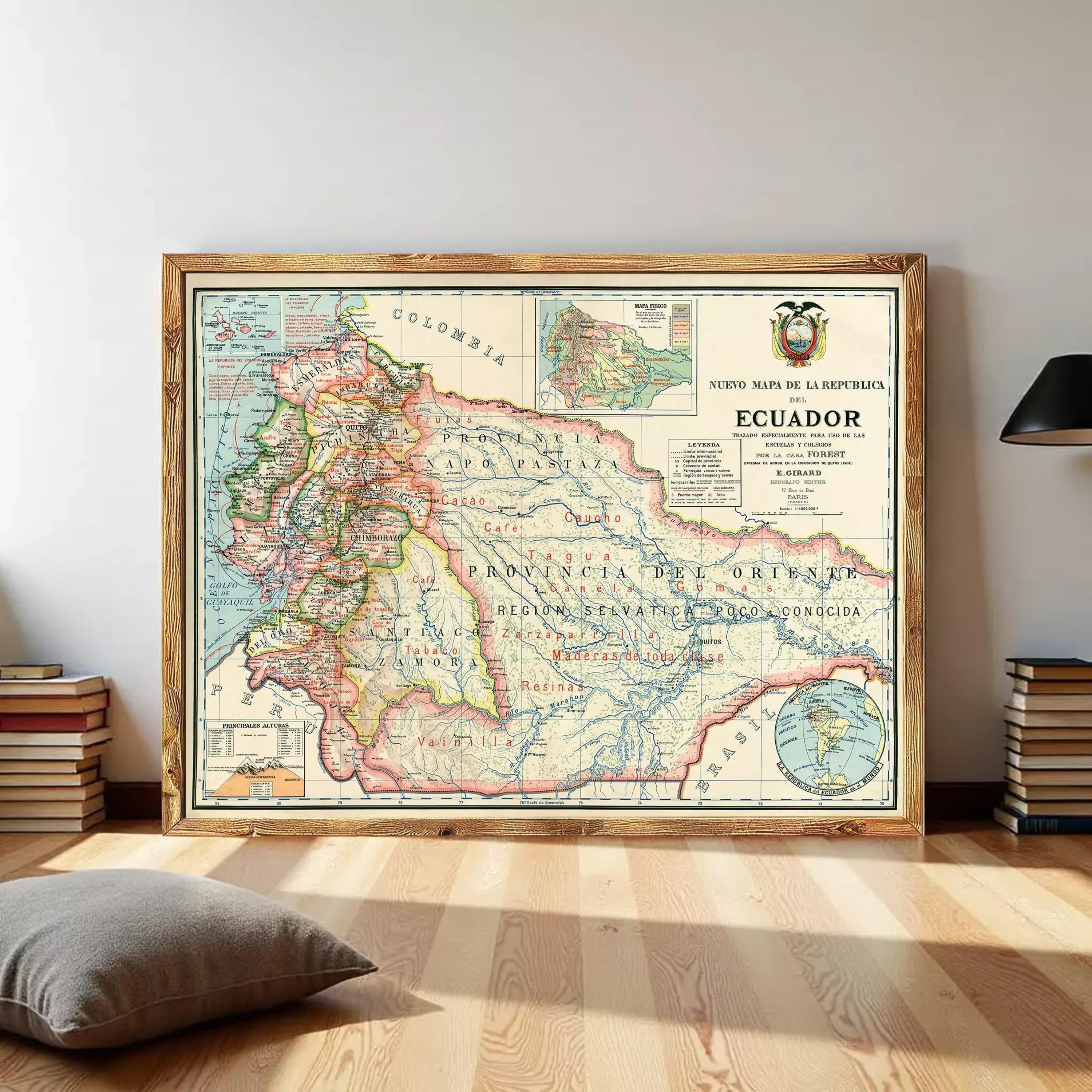 a large framed map of Ecuador, with a wooden frame and a black lamp to the right.