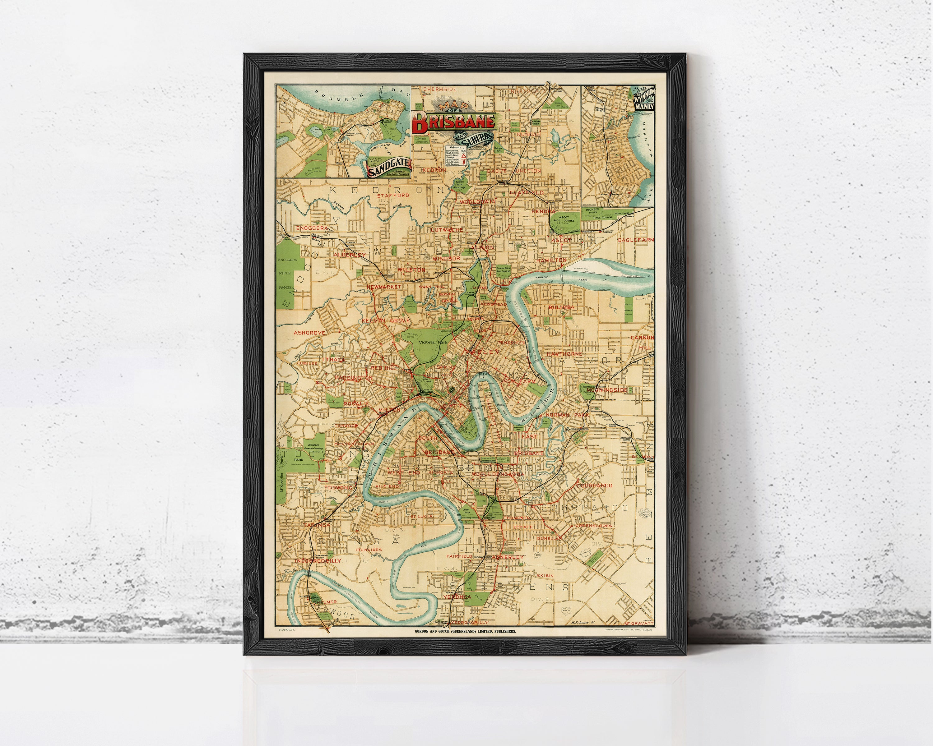 The image is a framed vintage map of a city, likely Birmingham, with various streets, landmarks, and rivers depicted.