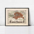 The image is a framed vintage map of a city, depicting a detailed layout of streets, landmarks, and other geographical features.