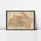 The image is a framed map of a city, showing various streets, buildings, and other urban features.