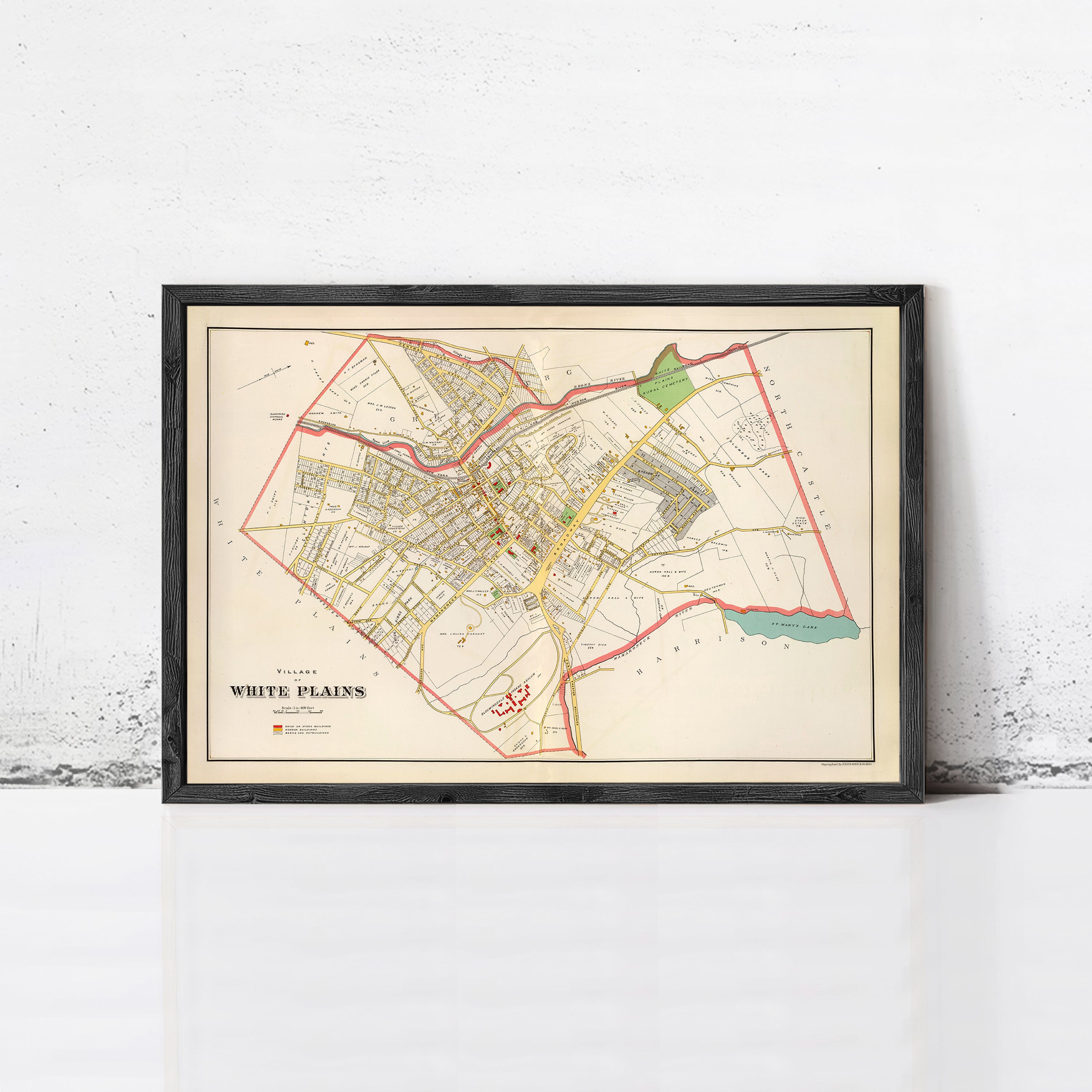 The image is a framed map of White Plains, New York, with a vintage style and a black border.