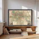 A framed map of London is displayed on a shelf, surrounded by books and other items.