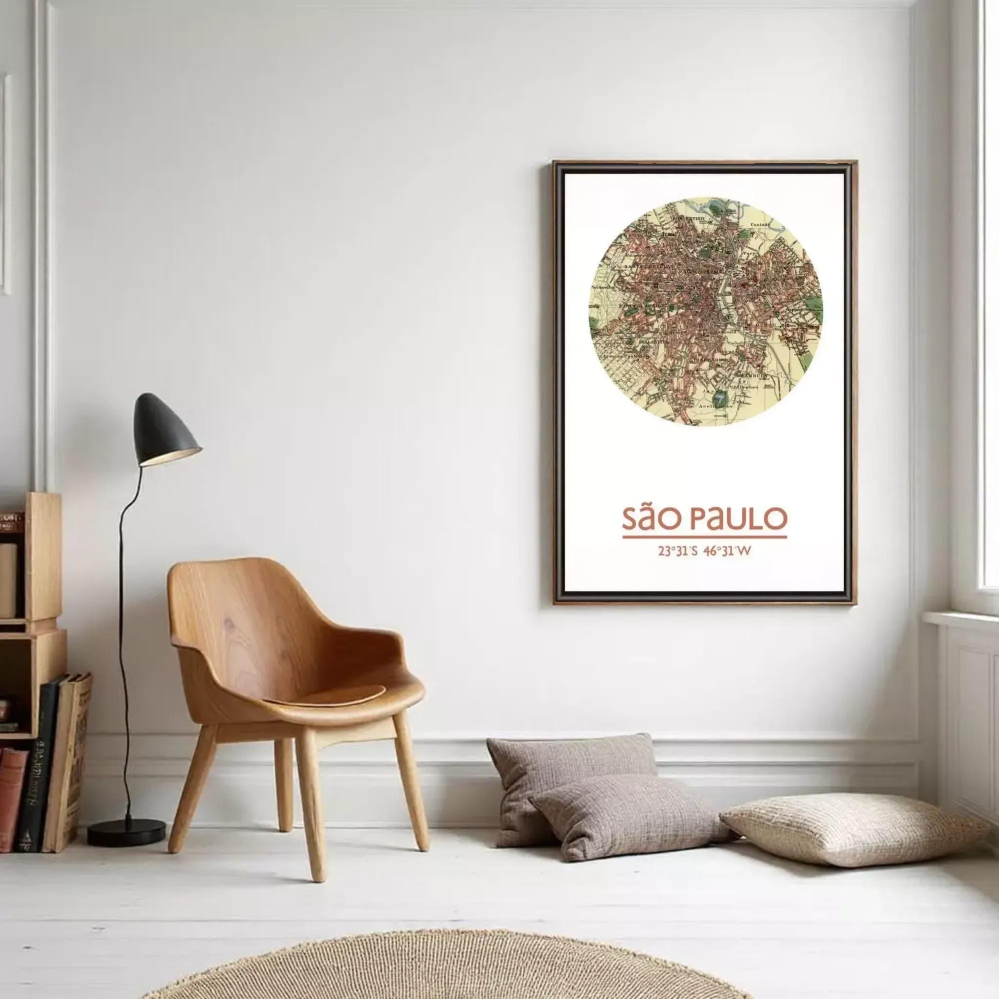 a cozy living room with a wooden chair, a lamp, and a framed map of São Paulo, Brazil, hanging on the wall.