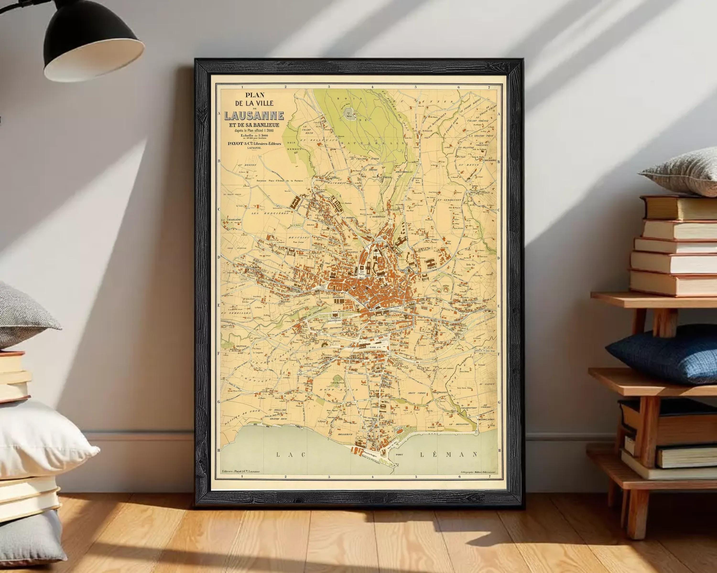 The image is a framed vintage map of the city of Lausanne, Switzerland, depicting the city's layout and surrounding areas.