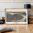 The image is a framed print of a detailed map of Boston, depicting the city's layout and surrounding areas.