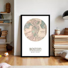 A framed map of Boston, with the city's name and location prominently displayed.