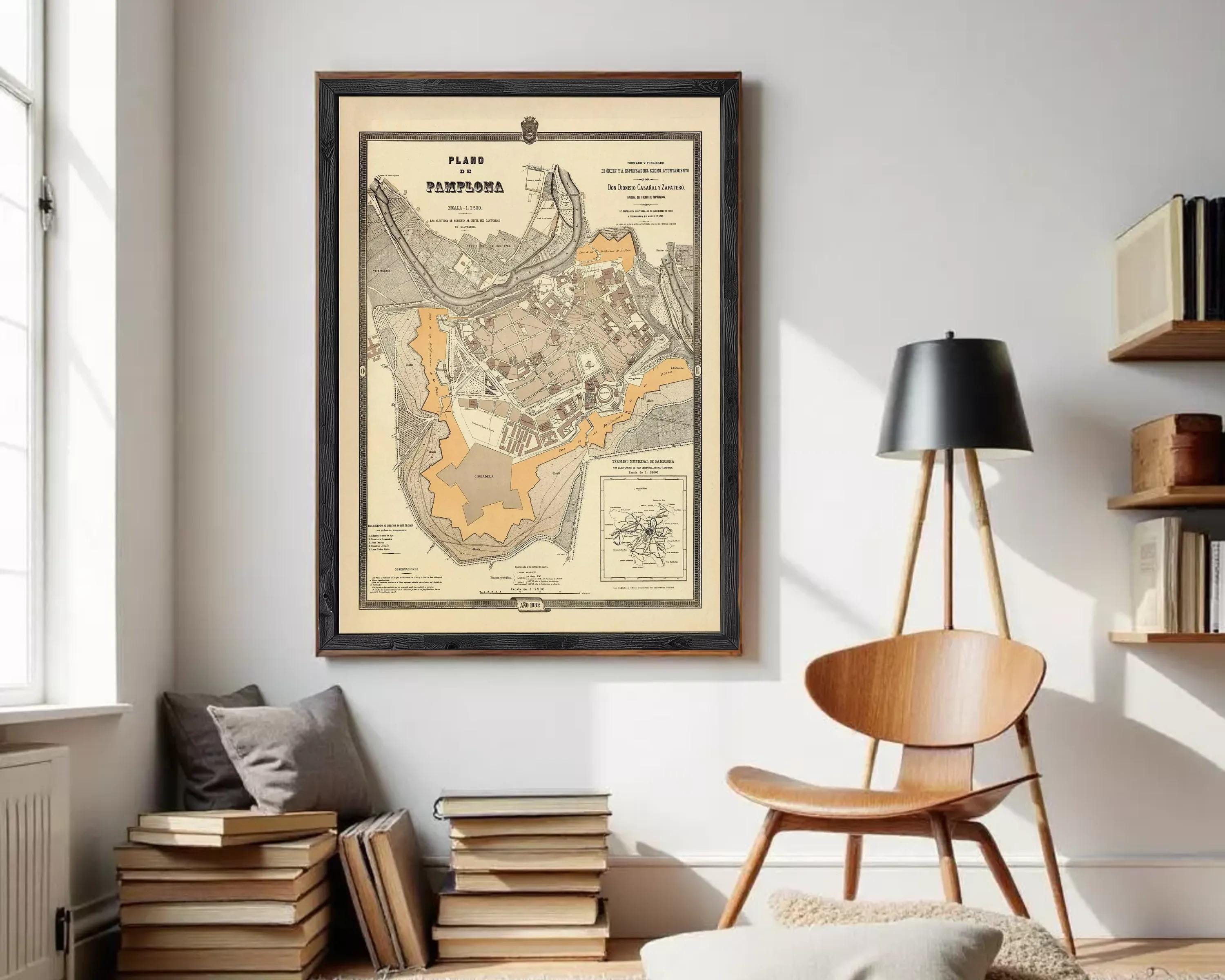The image is a framed historical map of Pamplona, Spain, depicting the city and surrounding areas.