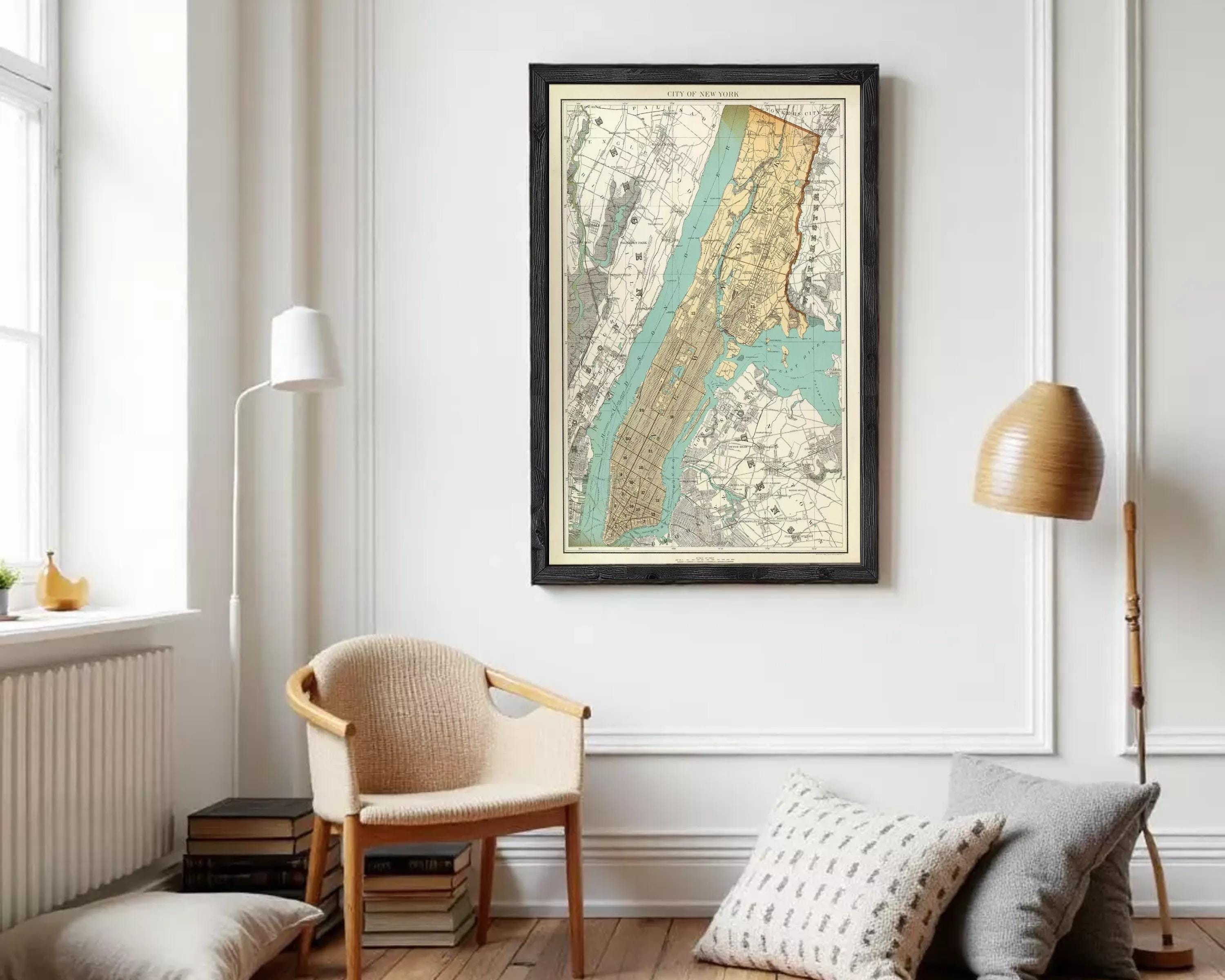The image is a framed vintage map of New York City, depicting the city's streets and surrounding areas.
