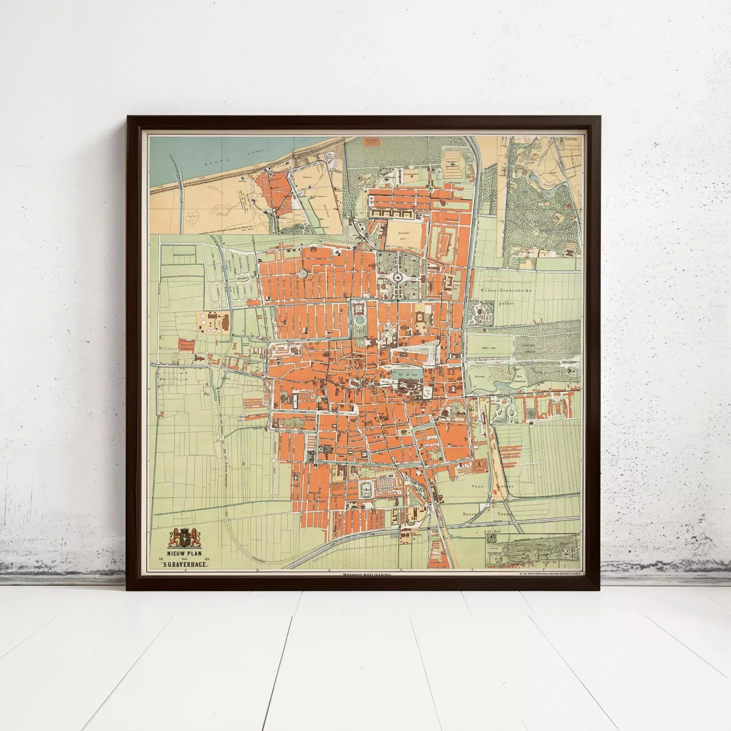 The image is a framed map of a city, likely from the 19th century, depicting a detailed layout of the city's streets, buildings, and other landmarks.
