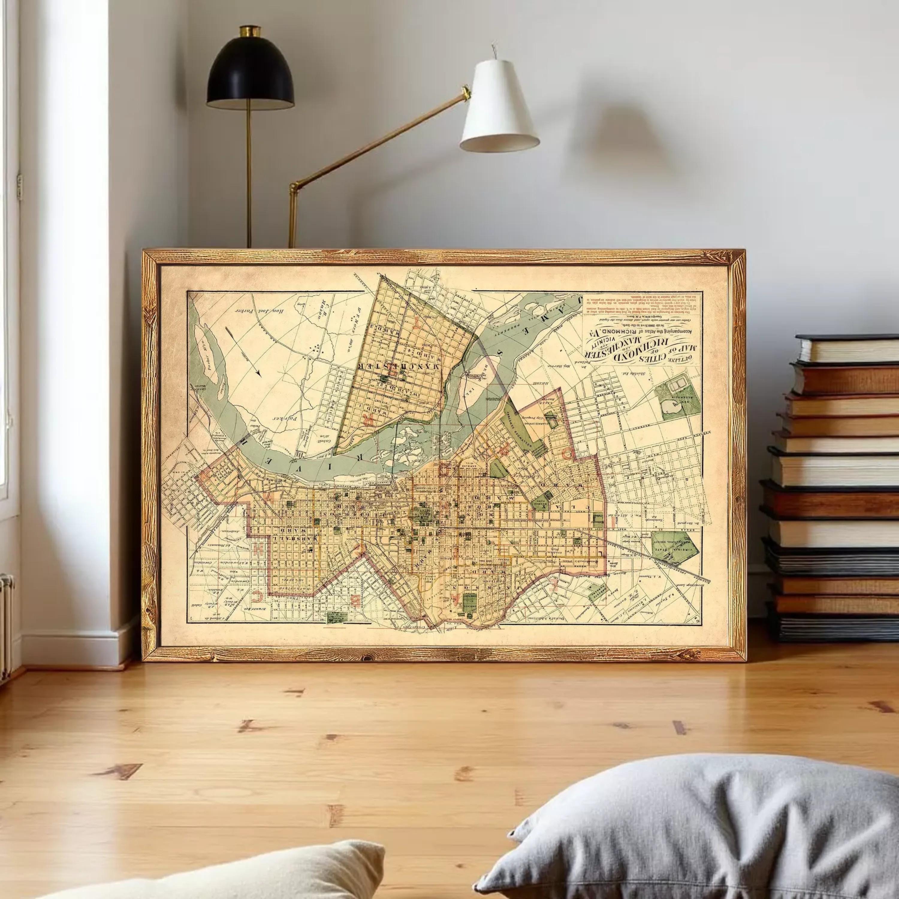 a large framed map of a city, with a wooden floor and a stack of books in the background.