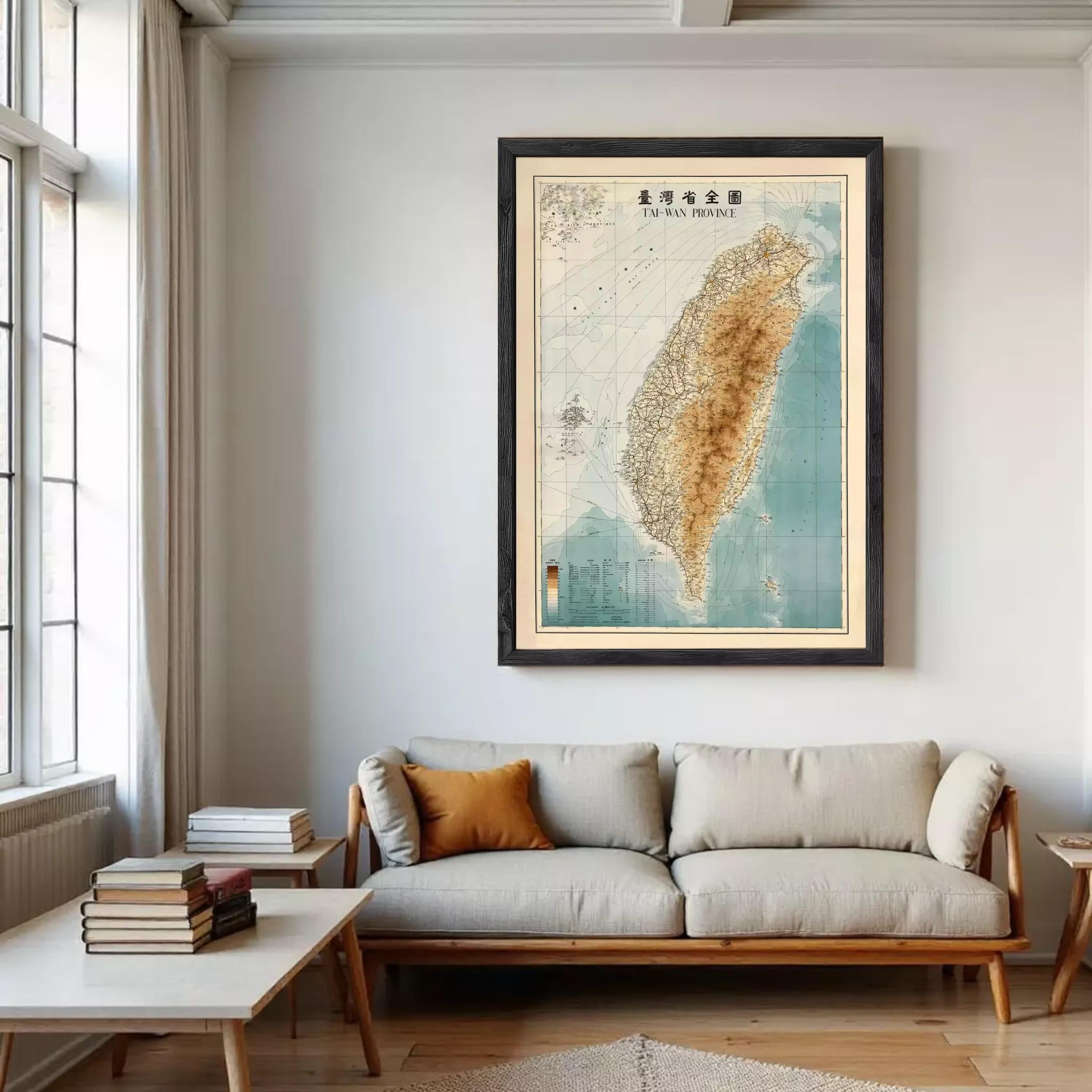 a large framed map of Taiwan hanging on a wall in a living room.