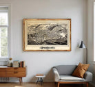 a large framed map of Thagetown, New York, hanging on a wall in a living room.