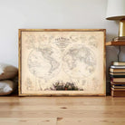 The image is a framed vintage map of the world, featuring detailed illustrations and labels.