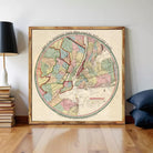 The image is a framed vintage map of New York City, depicting the city's geographical layout and surrounding areas.