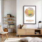 a modern living room with a wooden bookshelf, a wooden cabinet, and a framed poster of a map of Barcelona hanging on the wall.
