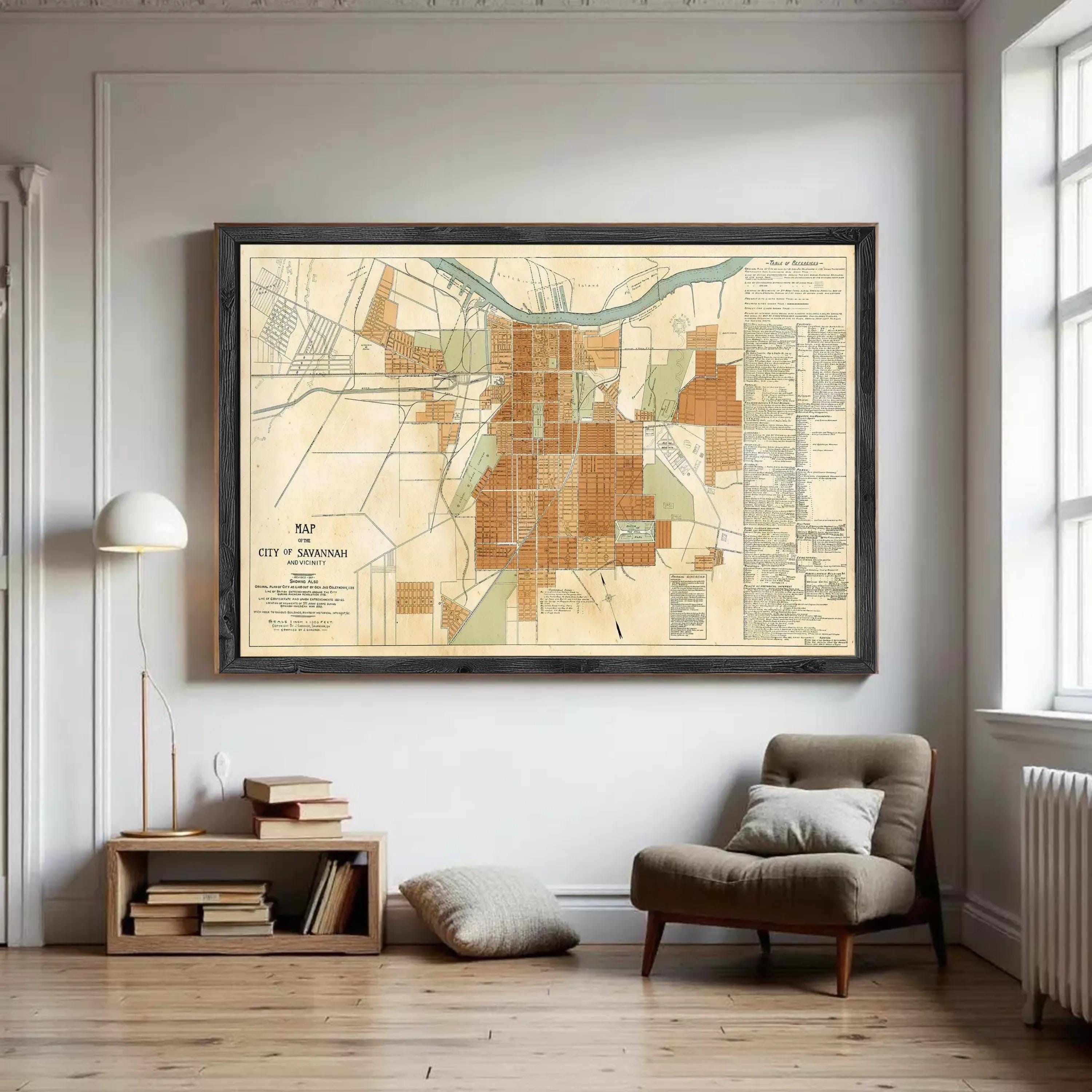 The image is a framed map of the city of Savannah, Georgia, showing the layout of the city and surrounding areas.