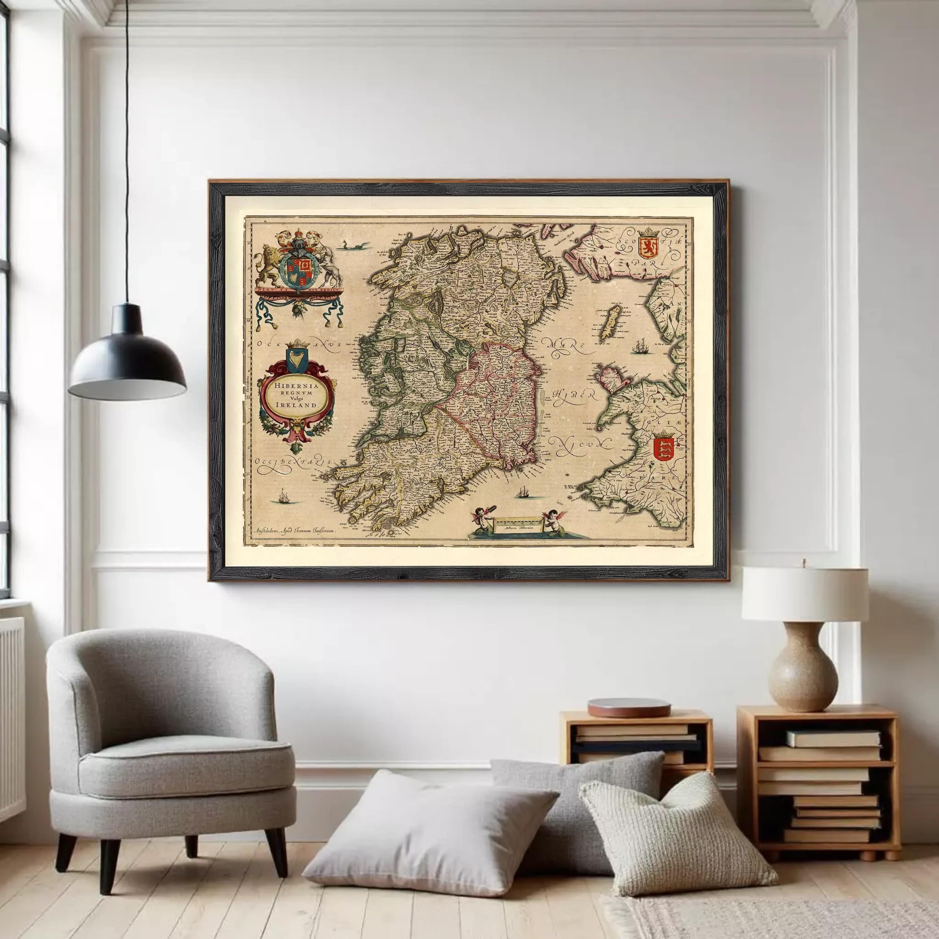 The image is a framed antique map of Ireland, featuring detailed cartography and illustrations.