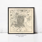 The image is a framed vintage map of a city, likely from the 18th century, depicting the layout and layout of the city.
