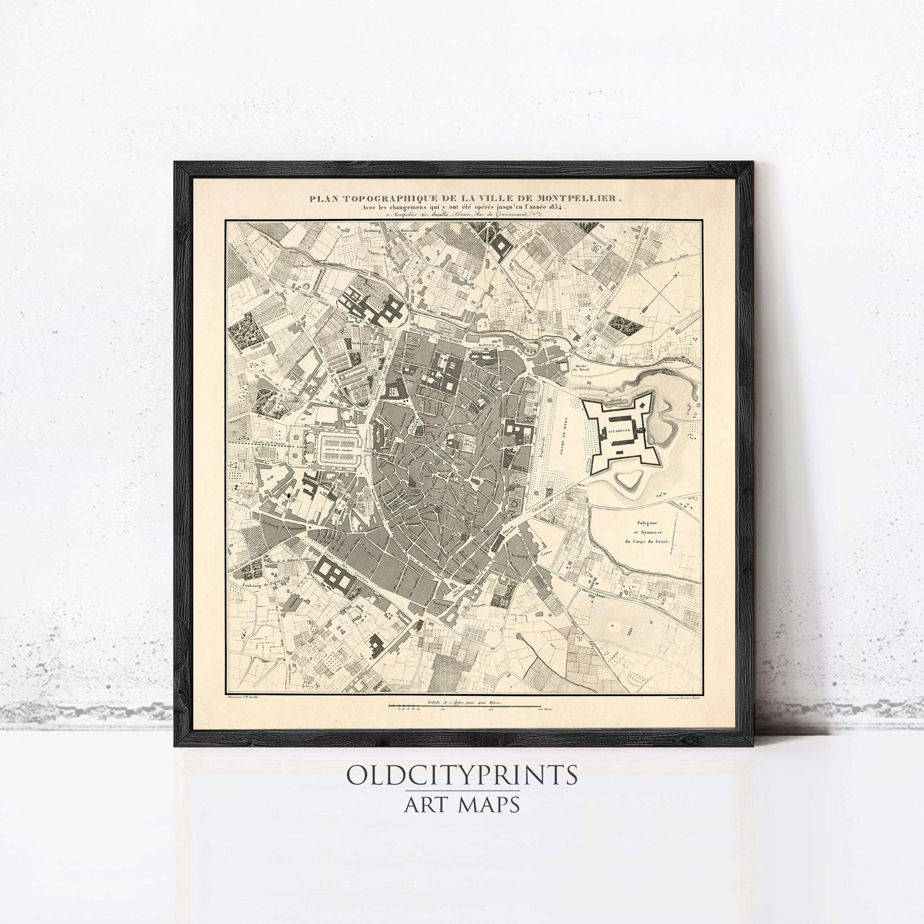The image is a framed vintage map of a city, likely from the 18th century, depicting the layout and layout of the city.