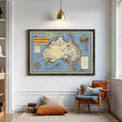 The image is a framed vintage map of Australia, depicting the country's geographical features and landmarks.