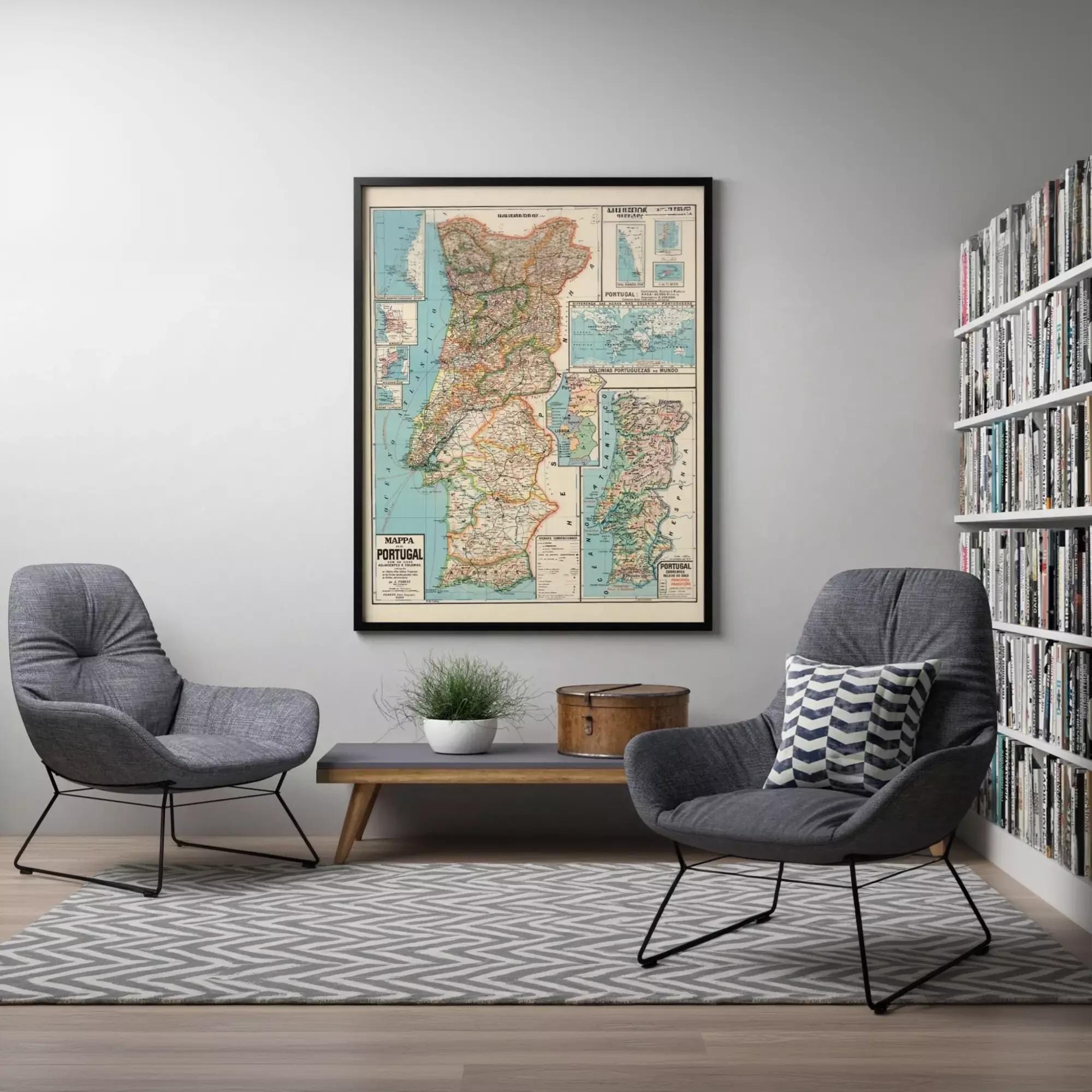 a cozy living room with a large framed map of Portugal hanging on the wall. The room is furnished with two gray armchairs and a wooden coffee table, creating a comfortable and inviting atmosphere.