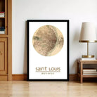 A framed map of Saint Louis, Missouri, with the text "Saint Louis 38° 37' 57.1°" below the map.