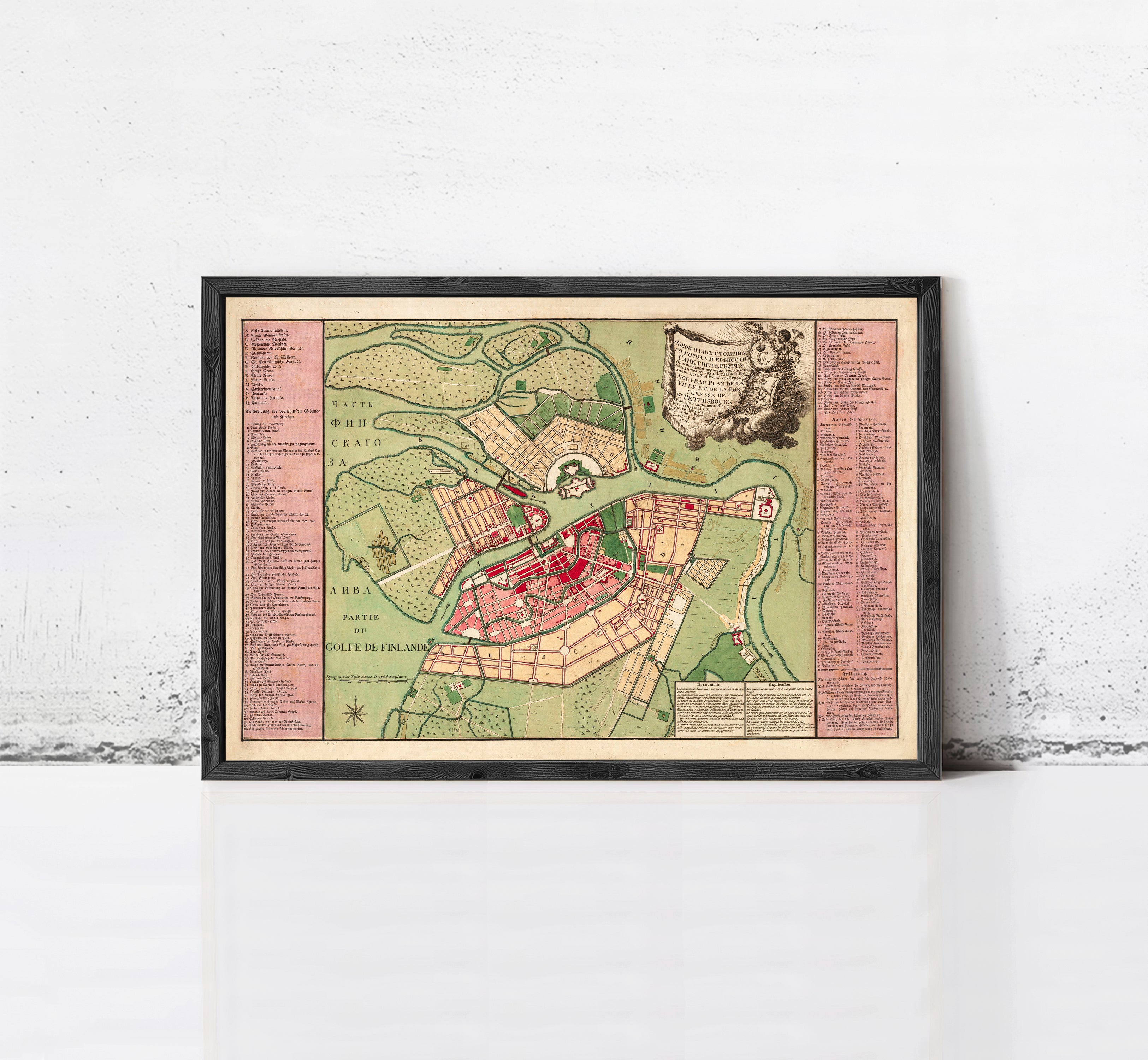The image is a framed map of a city, likely a historical or geographical map, displayed on a wall.